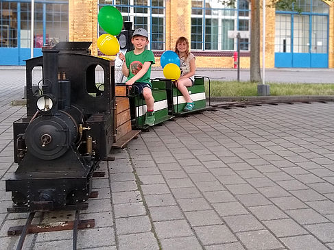 Children on a mini steam