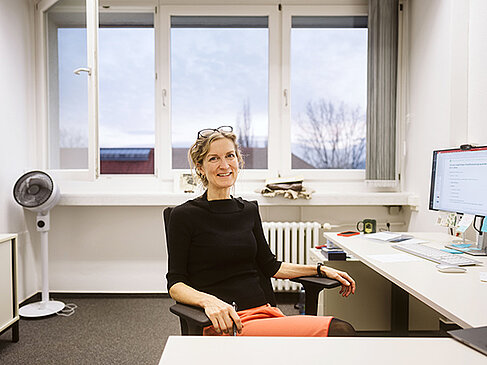 Christina Carlsen at her desk
