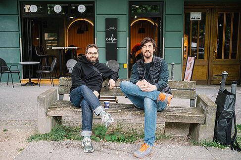Two men sitting on a bench